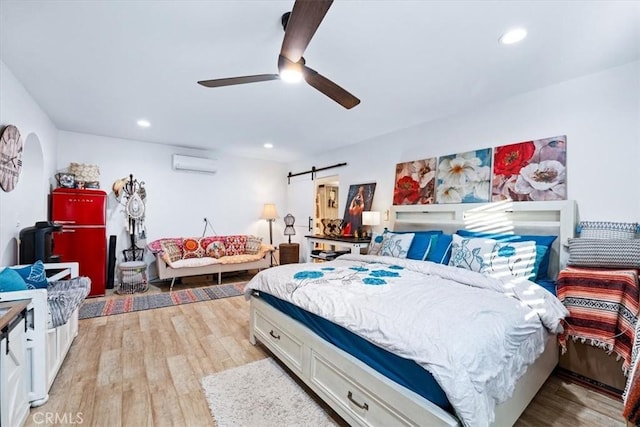 817 E Palmyra Ave, Orange, CA 92866 - bedroom with a wall mounted AC, a barn door, light wood finished floors, recessed lighting, and a ceiling fan