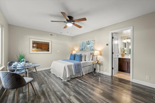 bedroom featuring hardwood / wood-style floors, connected bathroom, and ceiling fan