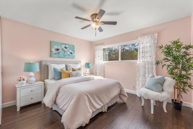 bedroom with ceiling fan and dark hardwood / wood-style flooring