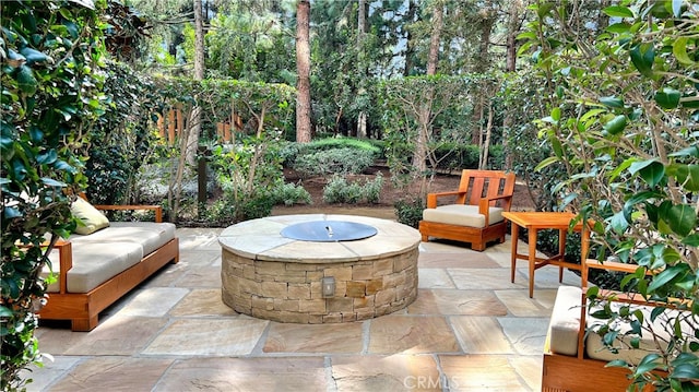 view of patio / terrace with an outdoor fire pit