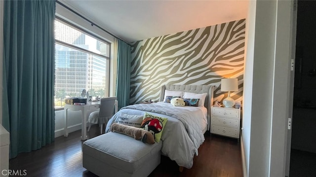 bedroom featuring dark hardwood / wood-style flooring