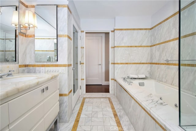 bathroom with shower with separate bathtub, tile floors, tile walls, and vanity