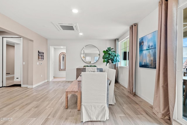dining area with light wood-type flooring
