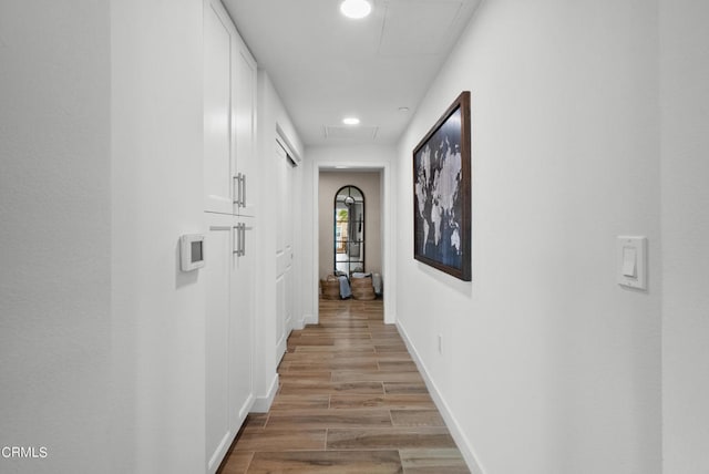 corridor with light wood-type flooring