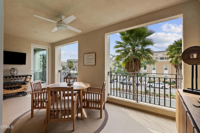 exterior space with a textured ceiling and ceiling fan