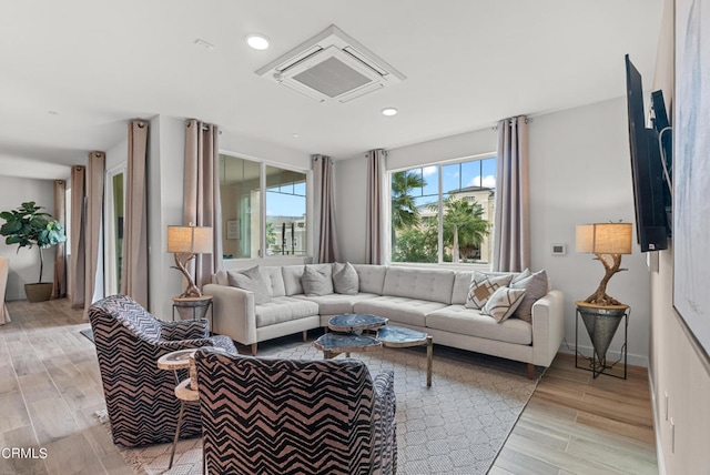 living room with light hardwood / wood-style floors