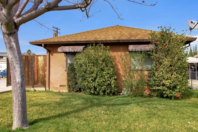 view of home's exterior featuring a lawn