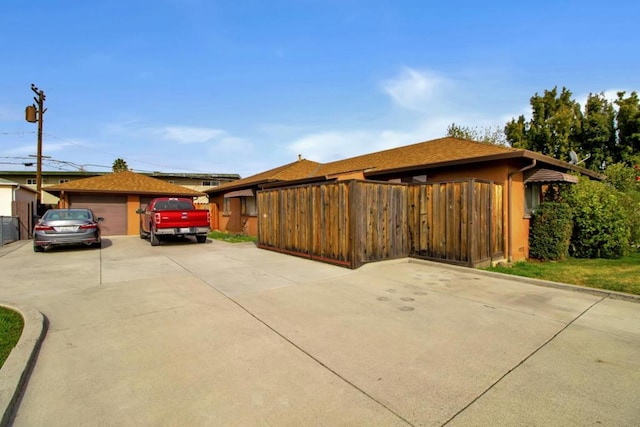 view of side of property with a garage