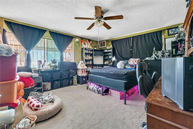 bedroom with a textured ceiling, ceiling fan, and carpet floors