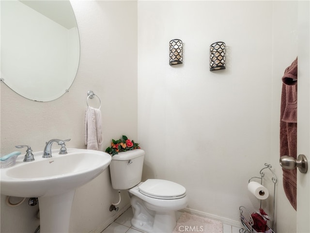 bathroom with tile patterned flooring and toilet