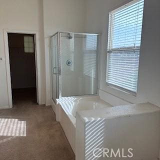 bathroom featuring plus walk in shower