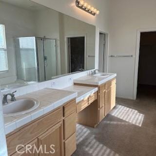 bathroom with vanity and walk in shower