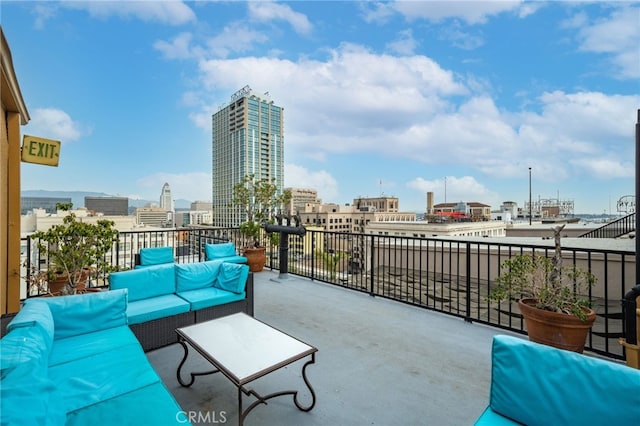 view of terrace featuring a balcony and an outdoor living space