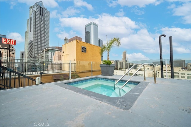 view of swimming pool featuring a community hot tub