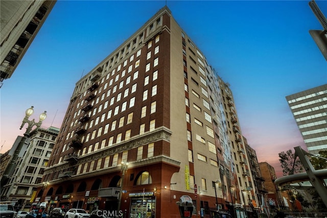 view of outdoor building at dusk