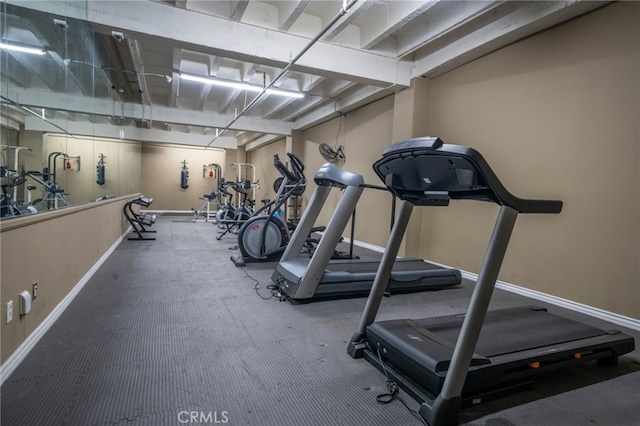 workout area featuring dark carpet