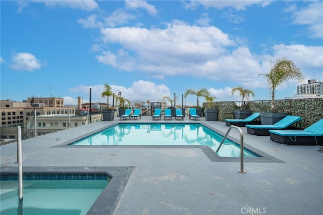 view of swimming pool featuring a patio area