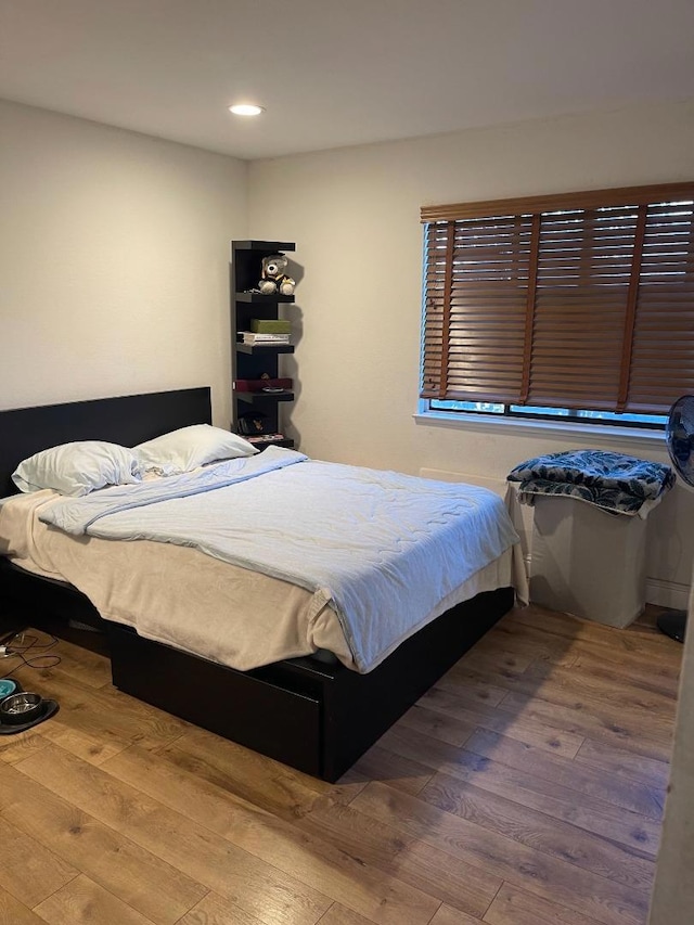 bedroom featuring wood-type flooring