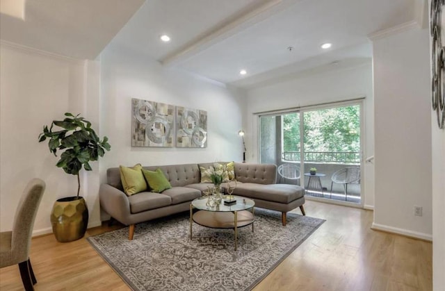 living room featuring beamed ceiling, hardwood / wood-style floors, and crown molding