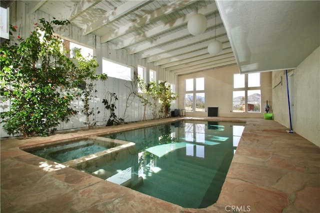 view of pool with an in ground hot tub