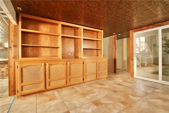 unfurnished room with lofted ceiling