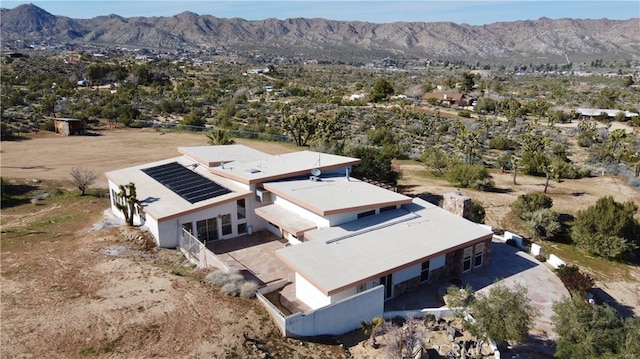 drone / aerial view featuring a mountain view