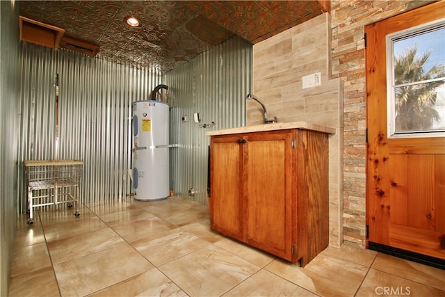 utility room featuring electric water heater