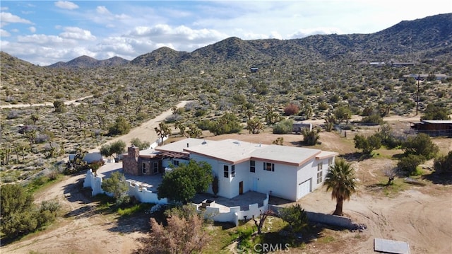 drone / aerial view featuring a mountain view