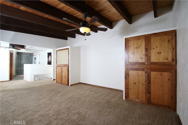 unfurnished living room with carpet, ceiling fan, wooden ceiling, and beamed ceiling