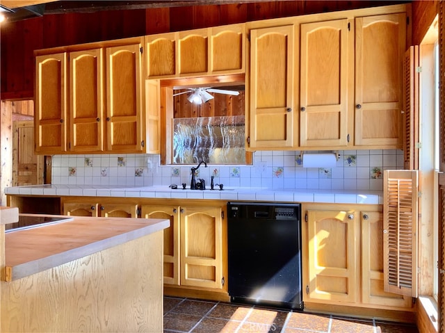 kitchen with tile countertops, dishwasher, sink, decorative backsplash, and stovetop