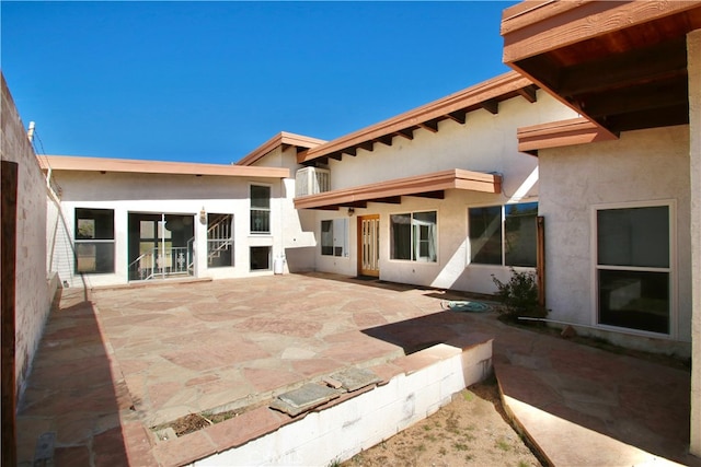 back of house featuring a patio