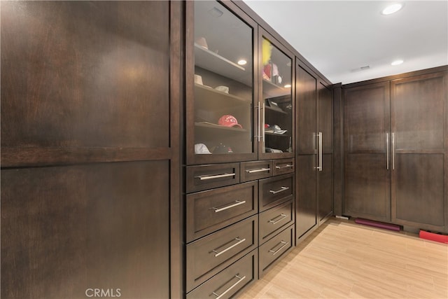 walk in closet featuring light wood-type flooring