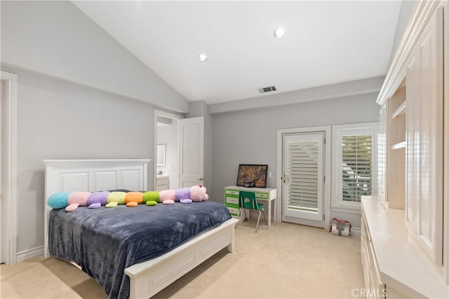 carpeted bedroom featuring vaulted ceiling