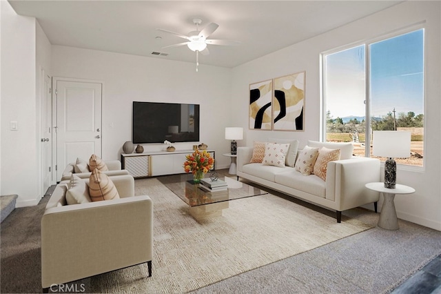 carpeted living room featuring ceiling fan