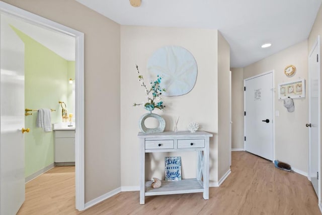 corridor featuring light hardwood / wood-style floors