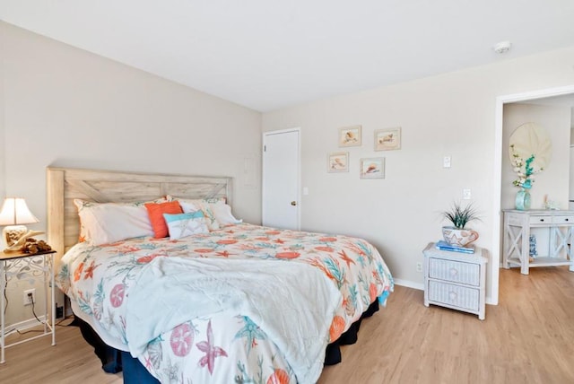 bedroom with light wood-type flooring