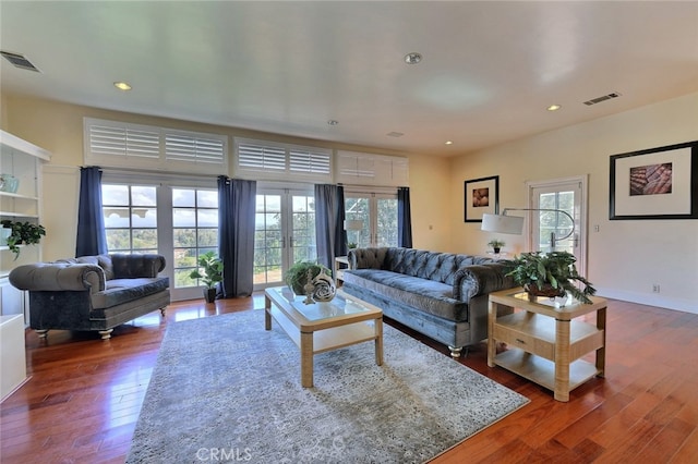 living room featuring dark wood-type flooring