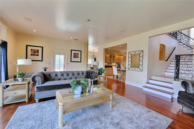 living room featuring dark wood-type flooring