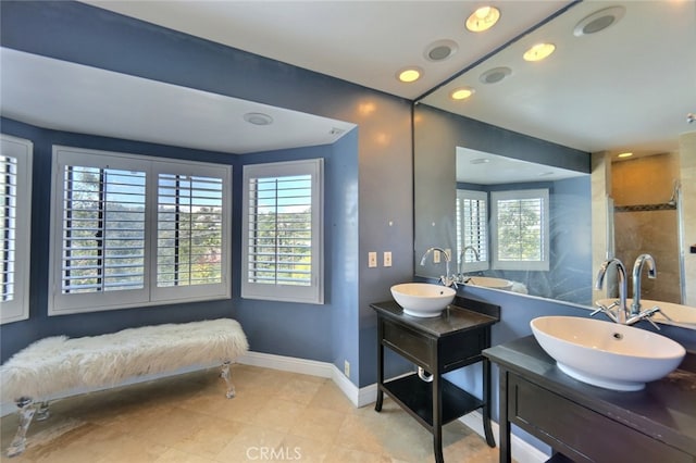 bathroom with double sink vanity and tile flooring