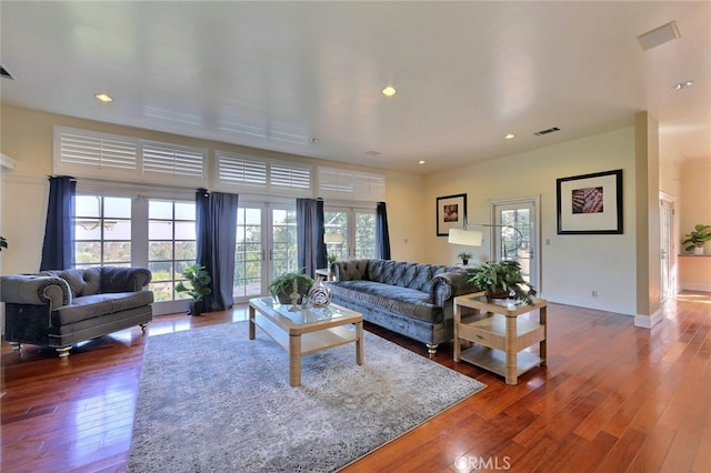 living room with dark hardwood / wood-style floors