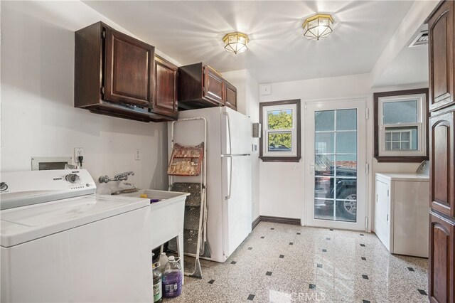 clothes washing area with separate washer and dryer