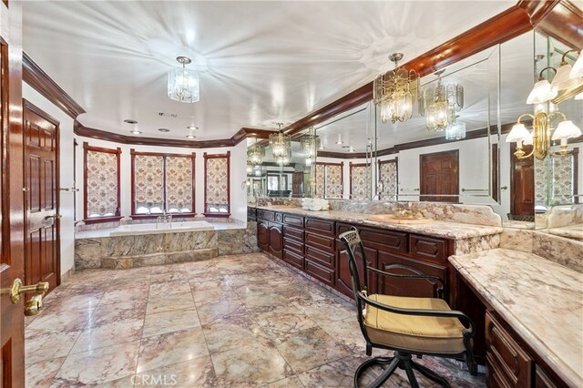 bathroom with crown molding, a washtub, and vanity