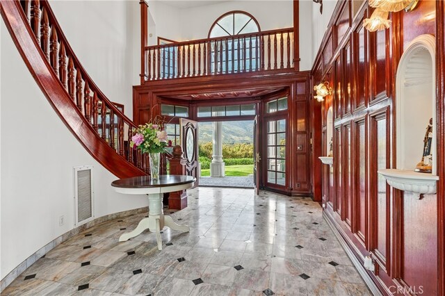 foyer featuring a high ceiling