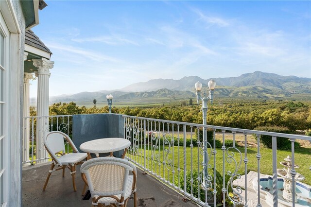 balcony featuring a mountain view