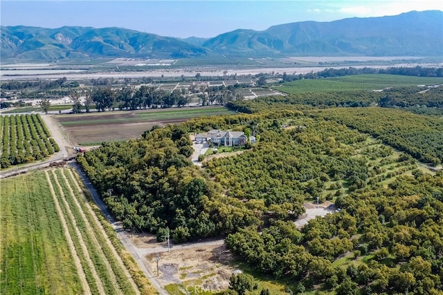 drone / aerial view with a mountain view and a rural view