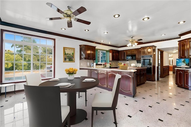 dining room featuring ceiling fan and ornamental molding