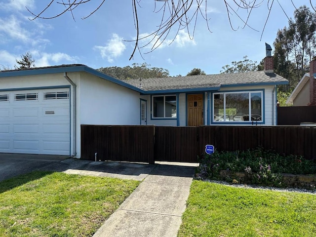 ranch-style house featuring a front lawn and a garage