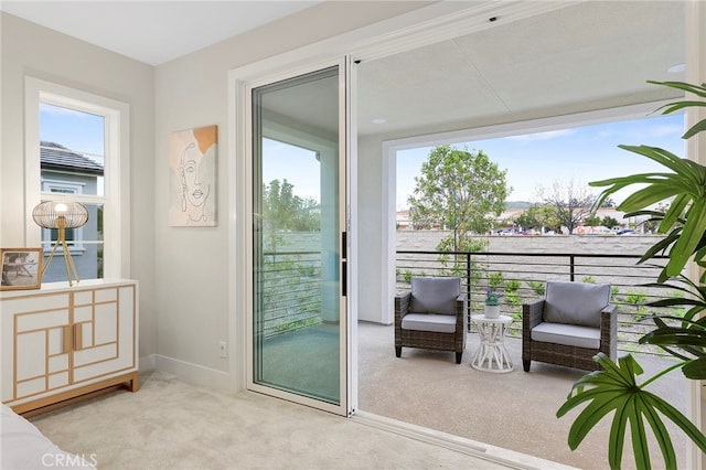 living area with light carpet