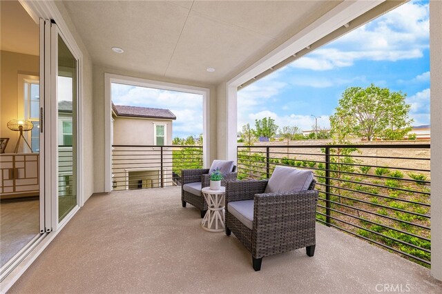 view of patio / terrace with a balcony