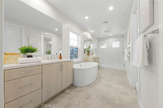 bathroom with shower with separate bathtub, tile flooring, and large vanity